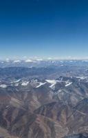 Himalaya mountains under clouds photo