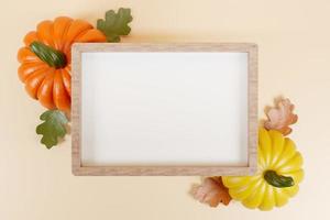 Wooden frame yellow and orange pumpkins with oak leaves Happy Thahksgiving template 3d render. photo