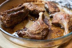 Duck meat baked in the oven with a crispy crust in an ovenproof dish