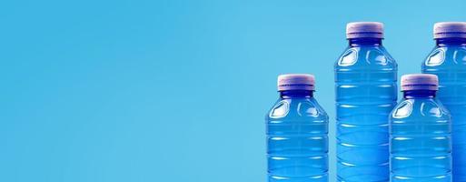 Plastic bottles on a blue background. The topic of plastic segregation and ecology in the world. Environmental protection banner. Place for text. photo