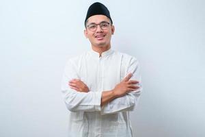 Asian muslim man smiling with arms crossed photo
