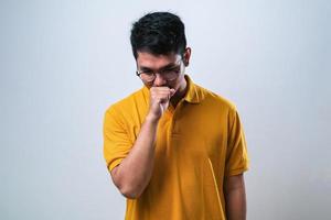 Young asian man coughing with sore throat, concept of man with allergy photo