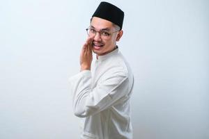 Asian Muslim men in muslim cloth, whispering secrets or gossips photo