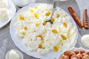 Cottage cheese on a white plate photo