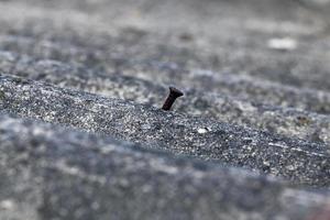 Old slate on the roof, nail photo