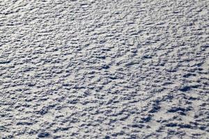 The snowdrifts in the field photo