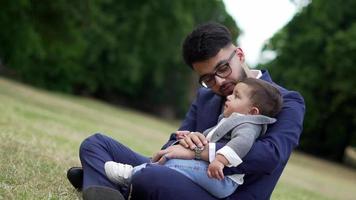 Asian Pakistani Father is holding his 11 Months Old Infant at Local Park video