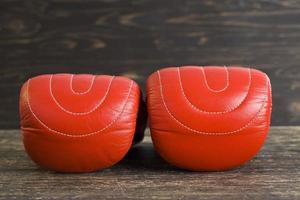 a pair of red boxing gloves photo