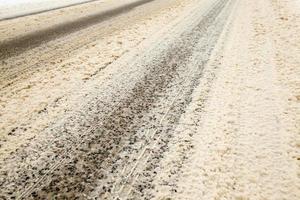 details of snow covered road photo