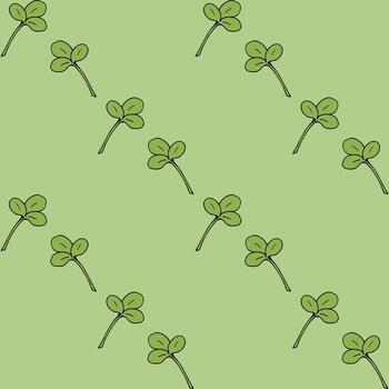Seamless pattern with clover leaves on light green background. Vector image.