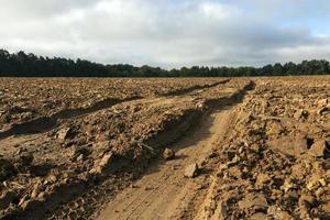 Track on plowed field photo