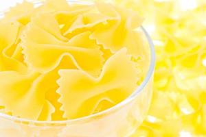 Yellow noodles in a glass photo
