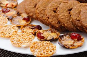 many different types of cookies lay on a plate photo