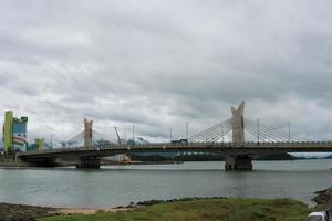 a bridge and cloudy weather photo