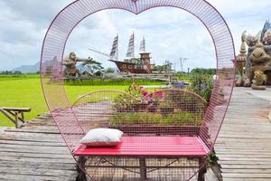 Photo corner for relaxing in a hammock in a resort in the middle of rice fields, a tourist attraction, Thai photography corner
