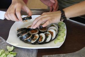 sushi rolls on trays photo