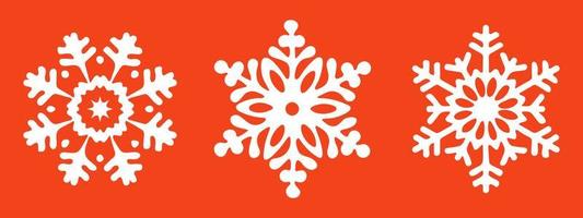 three snowflakes on a red background red vector