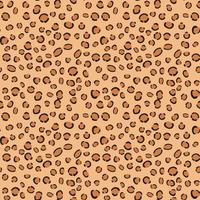 Seamless leopard print pattern on beige. Trendy background for fabric, paper, clothes. vector