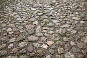 the old road is made of stones and cobblestones photo