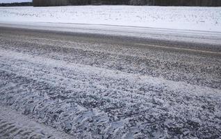 details of snow covered road photo