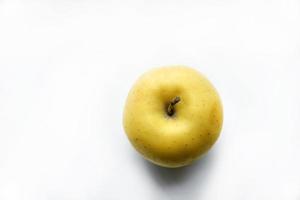 Yellow sweet apple on a white background photo