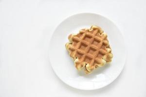 Viennese waffles on a white plate. Delicious waffles for breakfast. photo