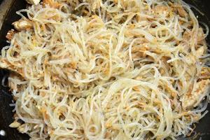 Korean noodles with spices and meat close-up. photo