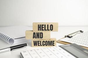 Hello and welcome symbol. Concept words Hello and welcome on wooden blocks photo