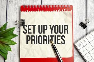 Set up your priorities - text on sticky note photo