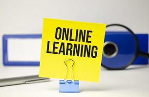 online learning text on yellow sticker and file folder photo