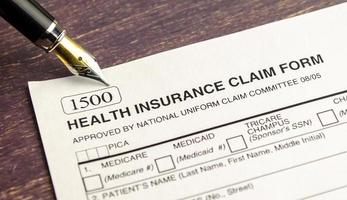 health insurance form, paperwork and questionnaire for insurance concepts photo