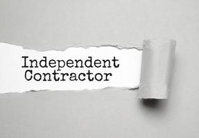 INDEPENDENT CONTRACTOR text on white torn paper photo