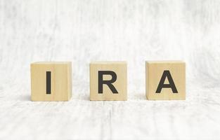 IRA - text is made up of letters on wooden cubes photo