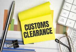 sheet of yellow paper with the text CUSTOMS CLEARANCE photo