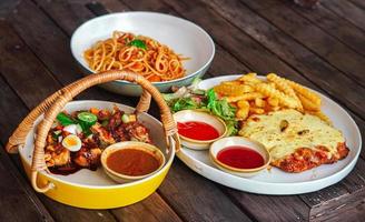 set meal of gado-gado traditional food from Indonesia, spaghetti, chicken mozzarella french fries photo