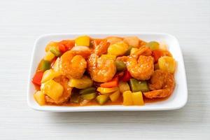 Stir-fried sweet and sour with fried shrimp photo