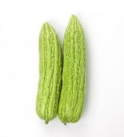 Organic green gourd vegetables isolated on white background photo