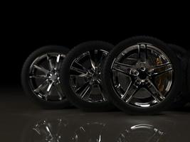 auto wheel with chrome disks close-up on a dark background. 3d render photo