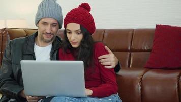Man and woman with laptop video