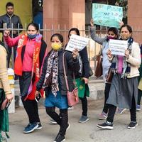 New Delhi, India December 25 2021 - Delhi Contractual Guest Teachers with posters, flags and graffitis protesting against Delhi AAP Government for making policy, Delhi Guest Teachers protesting photo