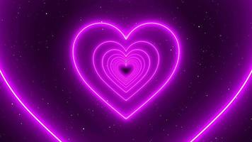 Infinite Looping Animation Neon pink Lights Love Heart Tunnel and Romantic Abstract Glow Particles - 4K Seamless Loop Motion Background Animation video