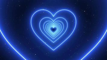 Infinite Looping Animation Neon Blue Lights Love Heart Tunnel and Romantic Abstract Glow Particles - 4K Seamless Loop Motion Background Animation video