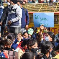 New Delhi, India December 25 2021 - Delhi Contractual Guest Teachers with posters, flags and graffitis protesting against Delhi AAP Government for making policy, Delhi Guest Teachers protesting photo