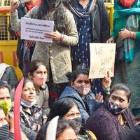 New Delhi, India December 25 2021 - Delhi Contractual Guest Teachers with posters, flags and graffitis protesting against Delhi AAP Government for making policy, Delhi Guest Teachers protesting photo