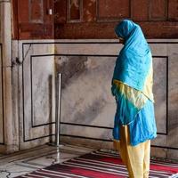 Delhi, India - April 15, 2022 - Unidentified Indian tourists visiting Jama Masjid during Ramzan season, in Delhi 6, India. Jama Masjid is the largest and perhaps the most magnificent mosque in India photo