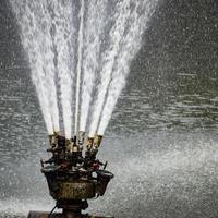 Fountain in the complex of Lodhi Garden in Delhi India, working fountain in the Lodhi Garden complex, water in the fountain, fountain in the Lodhi Garden park during morning time photo