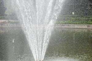 Fountain in the complex of Lodhi Garden in Delhi India, working fountain in the Lodhi Garden complex, water in the fountain, fountain in the Lodhi Garden park during morning time photo