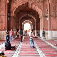 Delhi, India - April 15, 2022 - Unidentified Indian tourists visiting Jama Masjid during Ramzan season, in Delhi 6, India. Jama Masjid is the largest and perhaps the most magnificent mosque in India photo