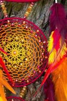 Handmade dream catcher with feathers threads and beads rope hanging photo