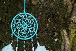 Handmade dream catcher with feathers threads and beads rope hanging photo